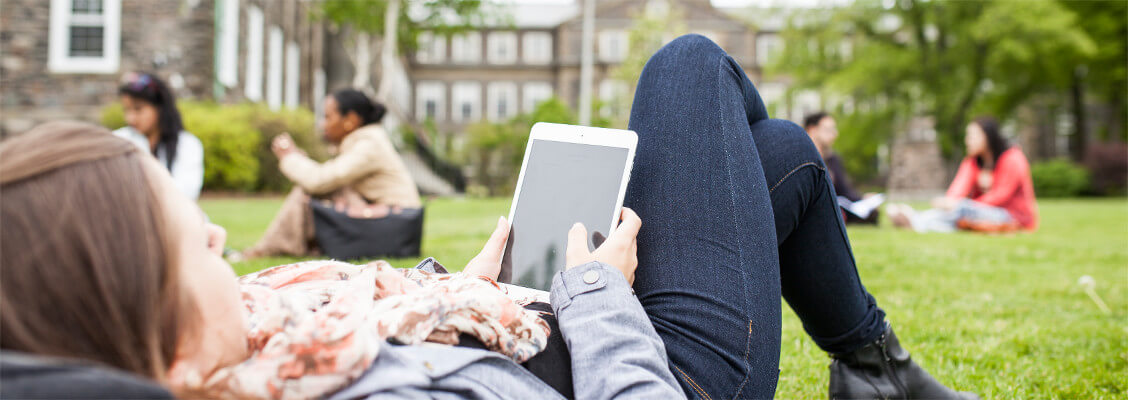 Students relaxing on the lawn in front of the Henry Hicks Budiling at Dalhousie University